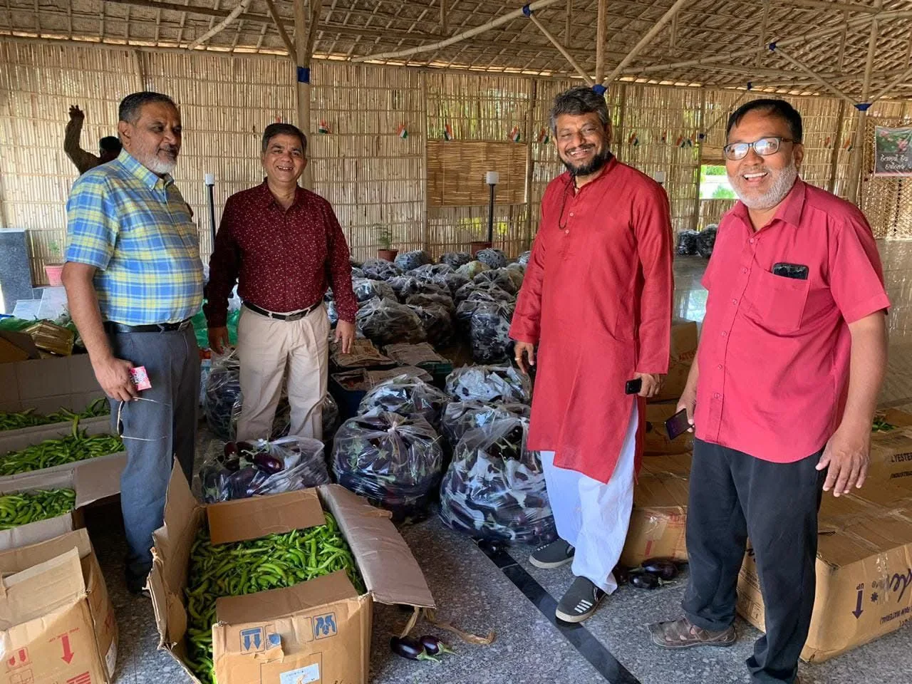 Tathya volunteers and community members during a vegetable distribution activity